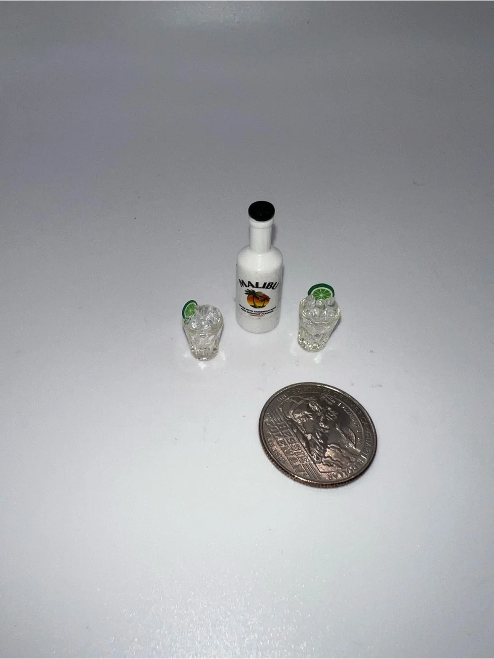 Miniature Malibu and set of drinking glasses